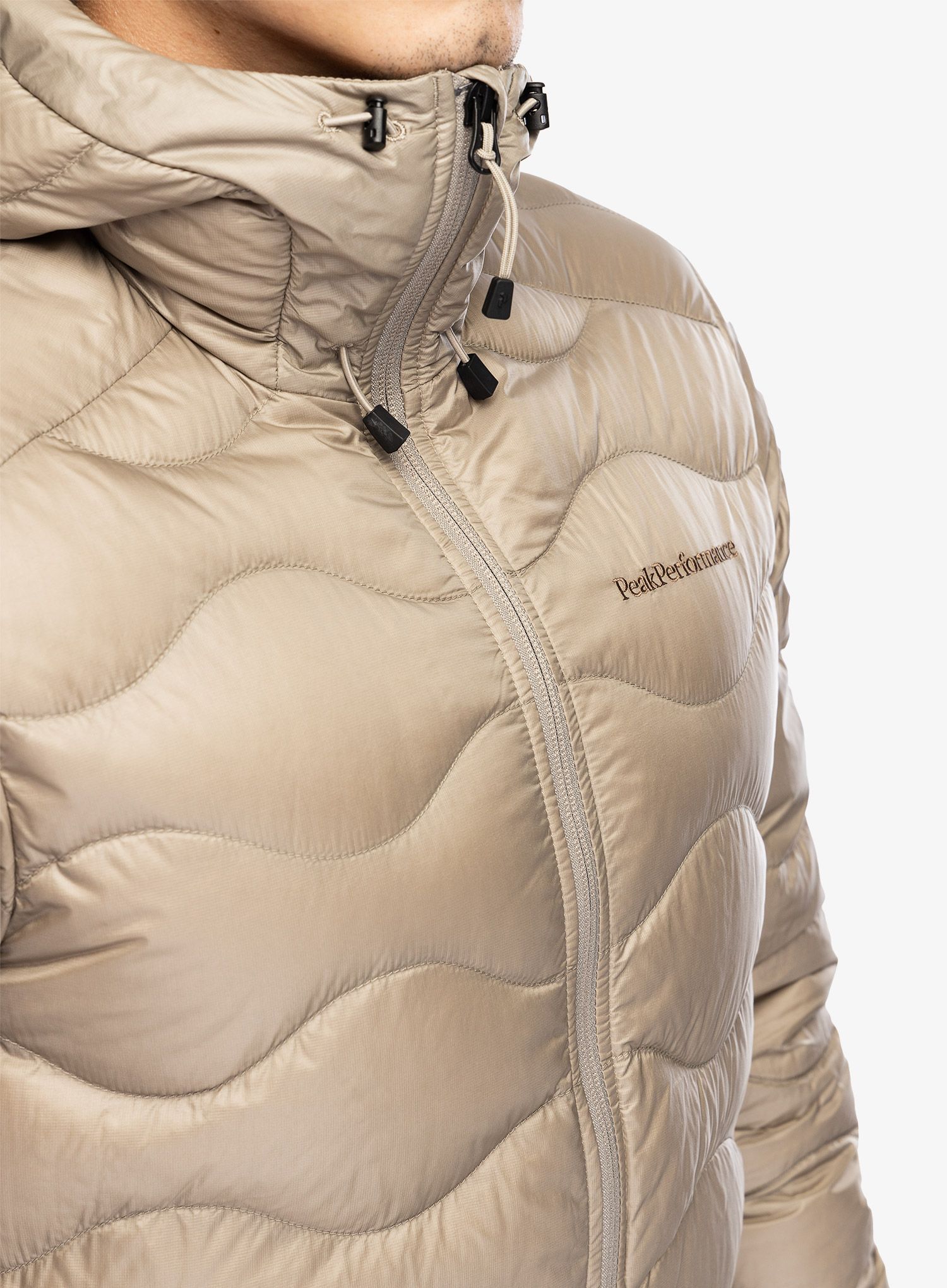 Páperová bunda Peak Performance Helium Down Hood Jacket - avid beige